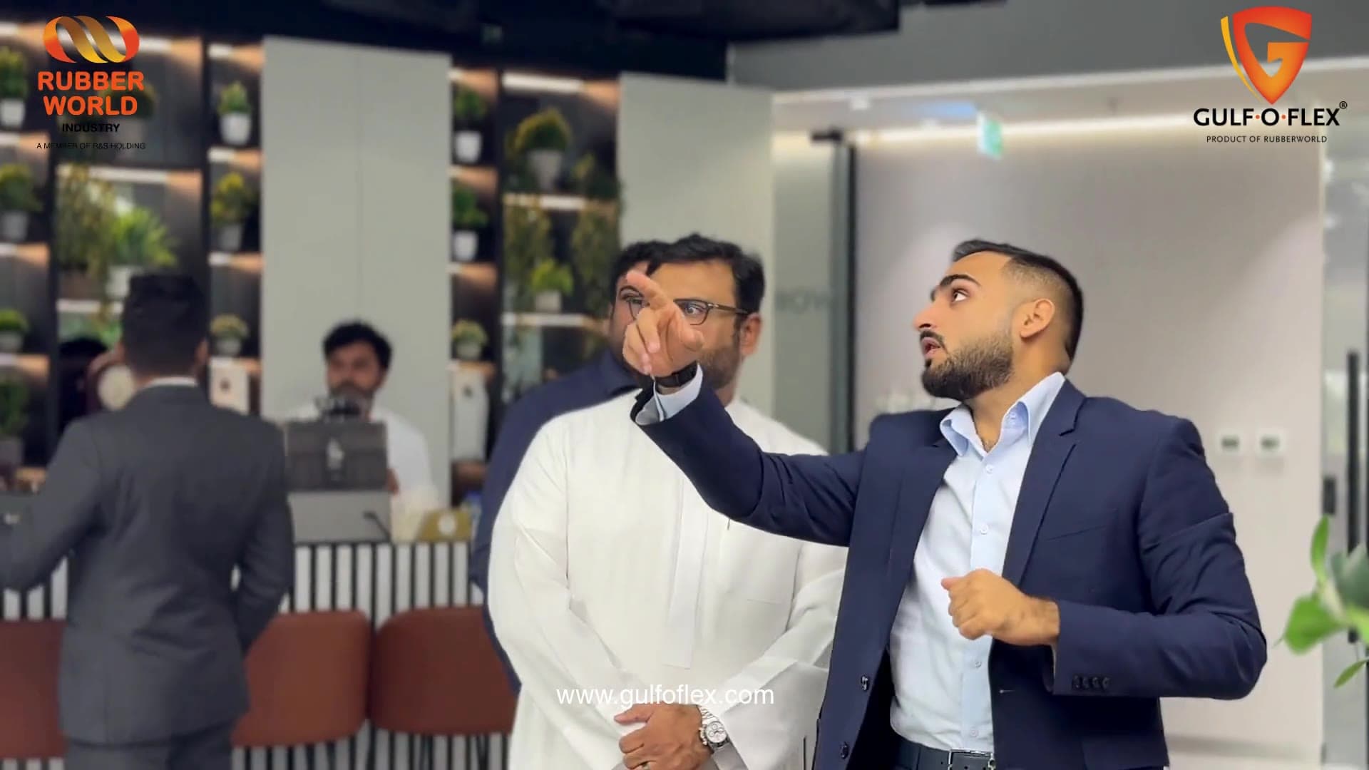 Gulf-O-Flex team member pointing out a feature of the centre to Salvo Corporation guests